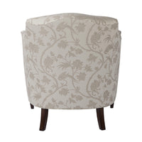 Floral patterned armchair, back view, wooden legs.