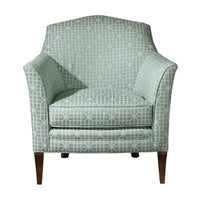 Geometric patterned armchair, front view, green fabric.