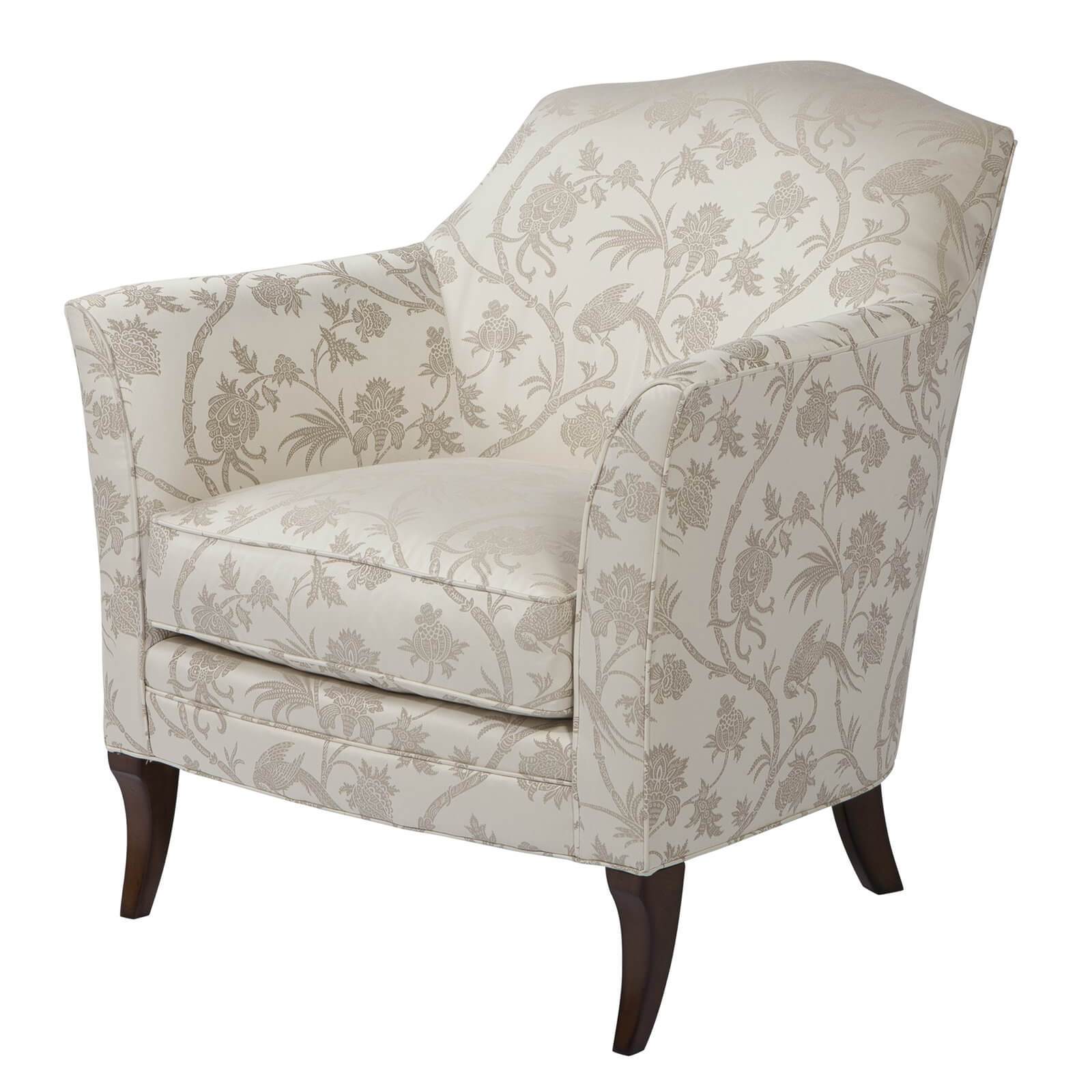Floral patterned armchair, front angle view, wooden legs.