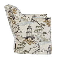 Beige armchair with nature print, side view.