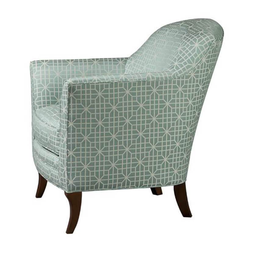 Geometric patterned armchair, side view, green fabric.
