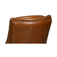 Top back detail of traditional brown leather chair