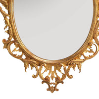 Bottom detail of traditional Chippendale oval mirror design.