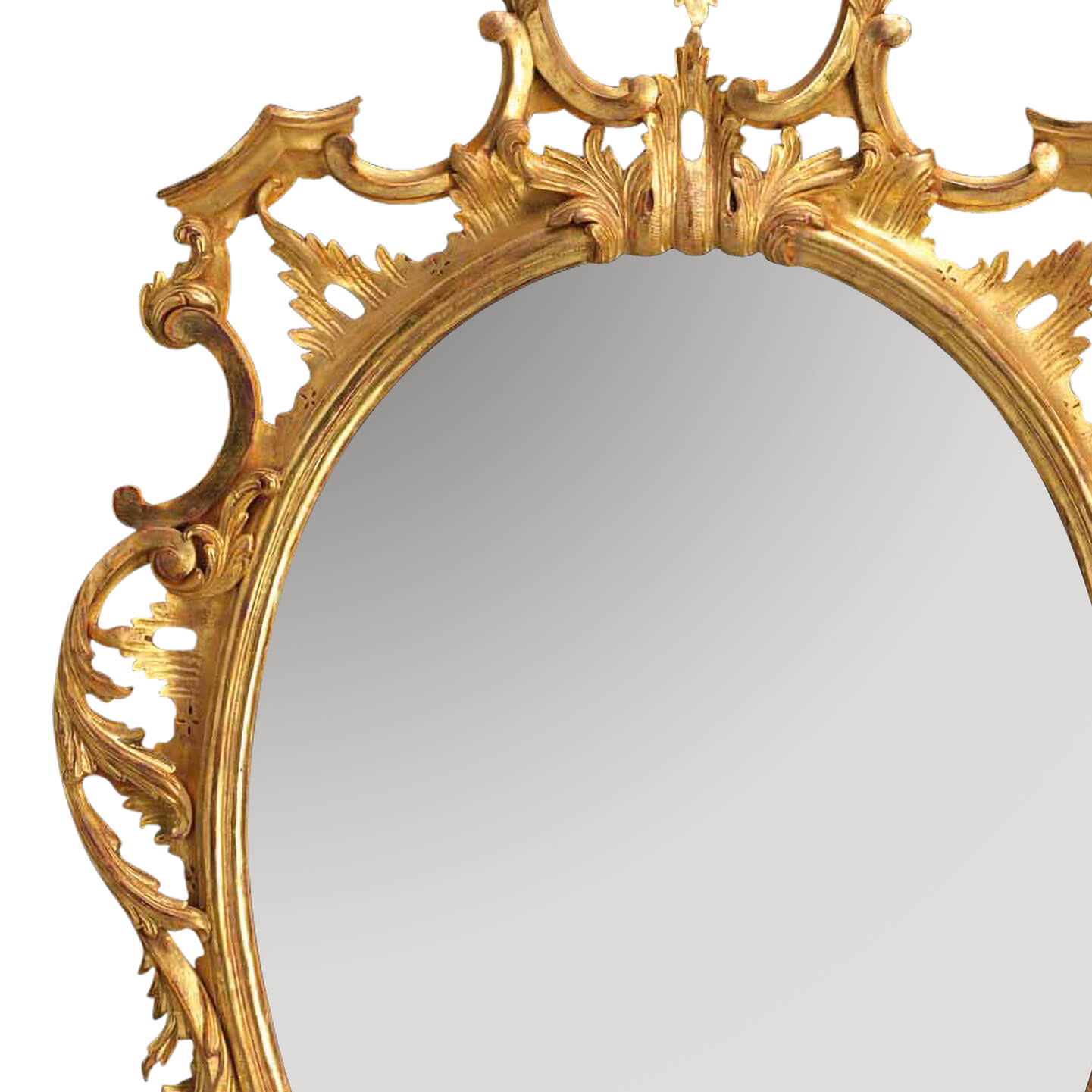 Close-up of traditional Chippendale mirror top corner design.