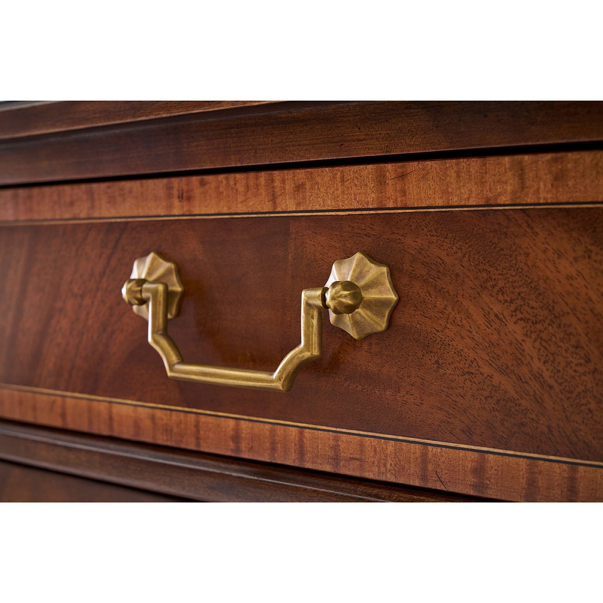 Traditional English sideboard, brass handle close-up.