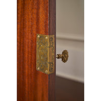 Close-up of sideboard hinge and ornate design.