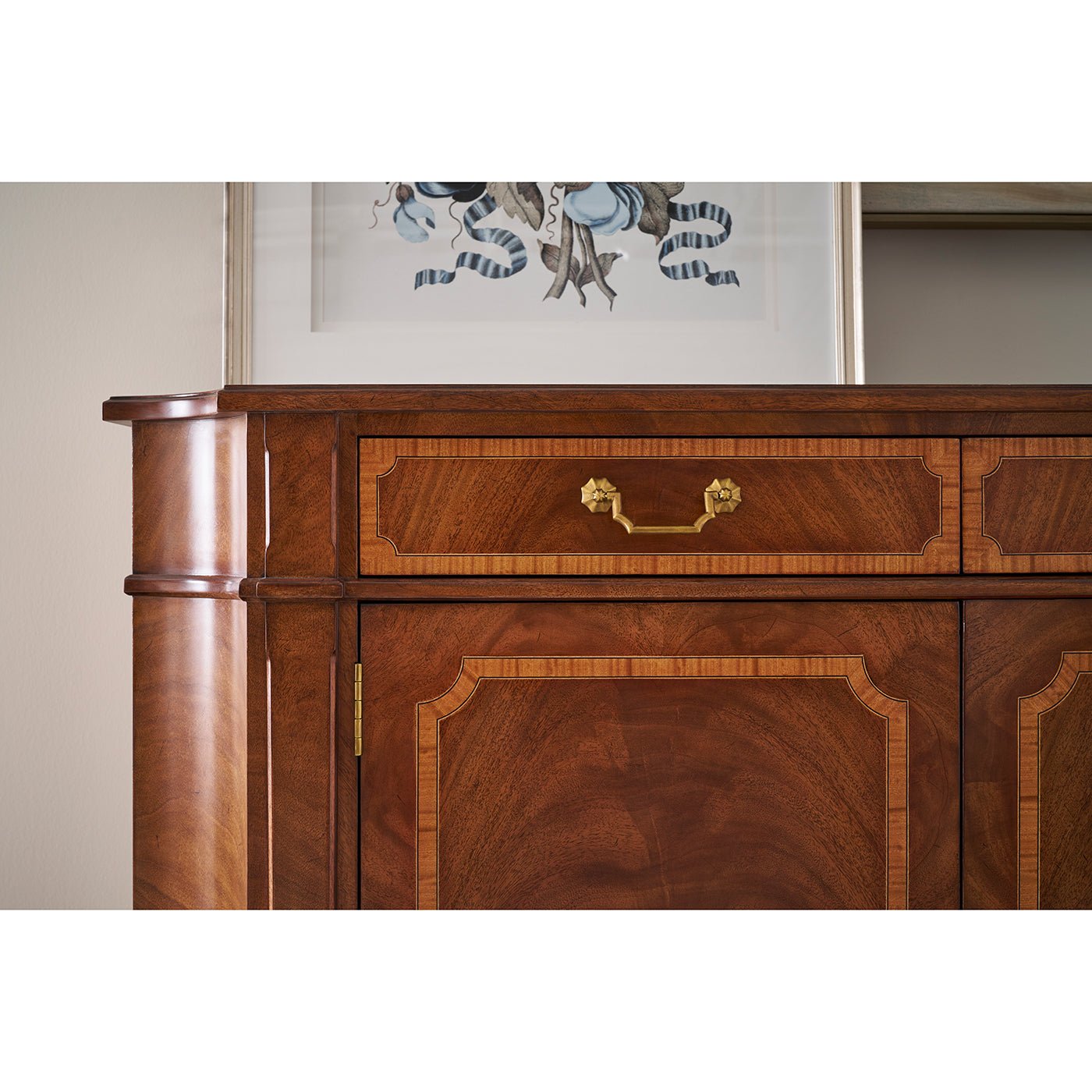 Upper section of sideboard with drawer and decor.