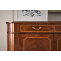 Upper section of sideboard with drawer and decor.