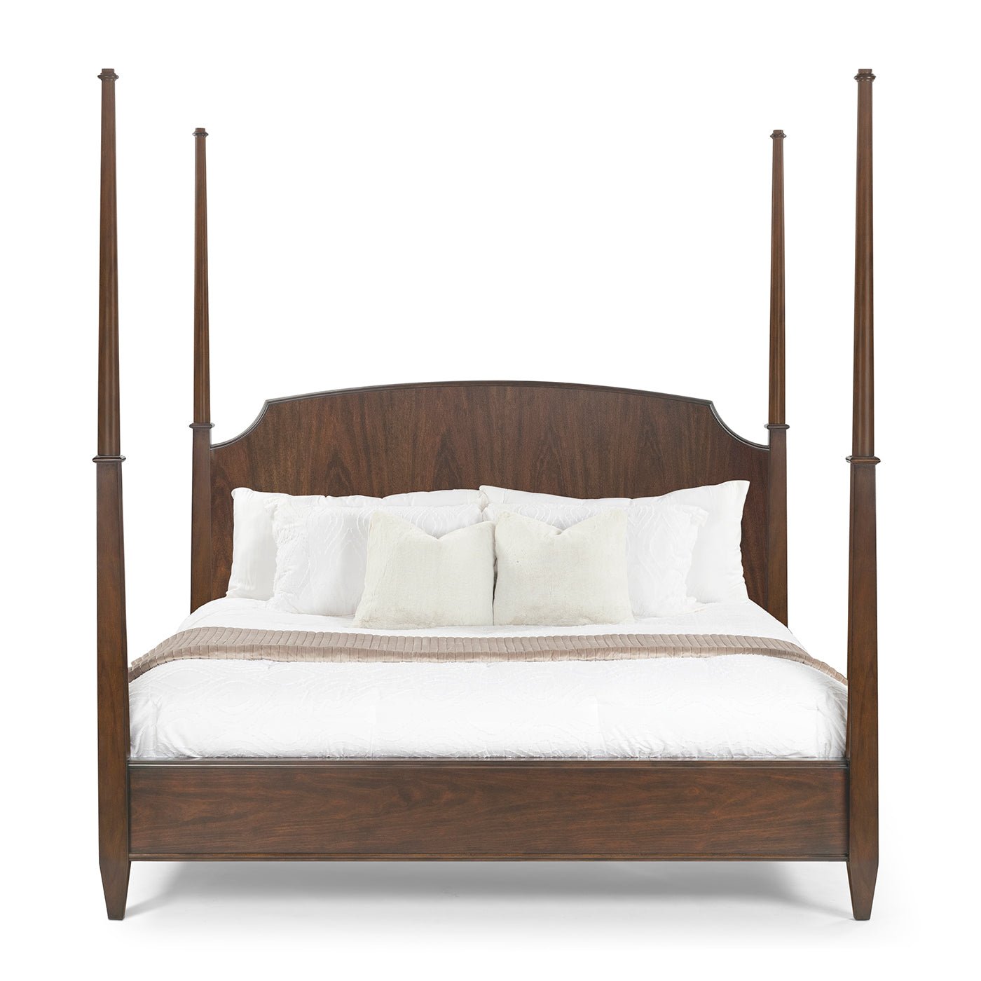 Front view of traditional king poster bed, made-up.