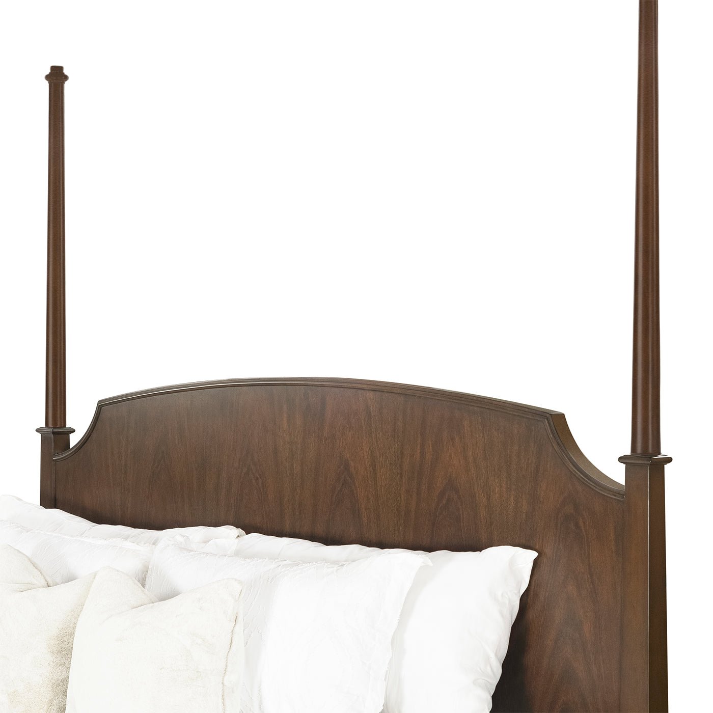 Close-up of headboard on traditional king poster bed.