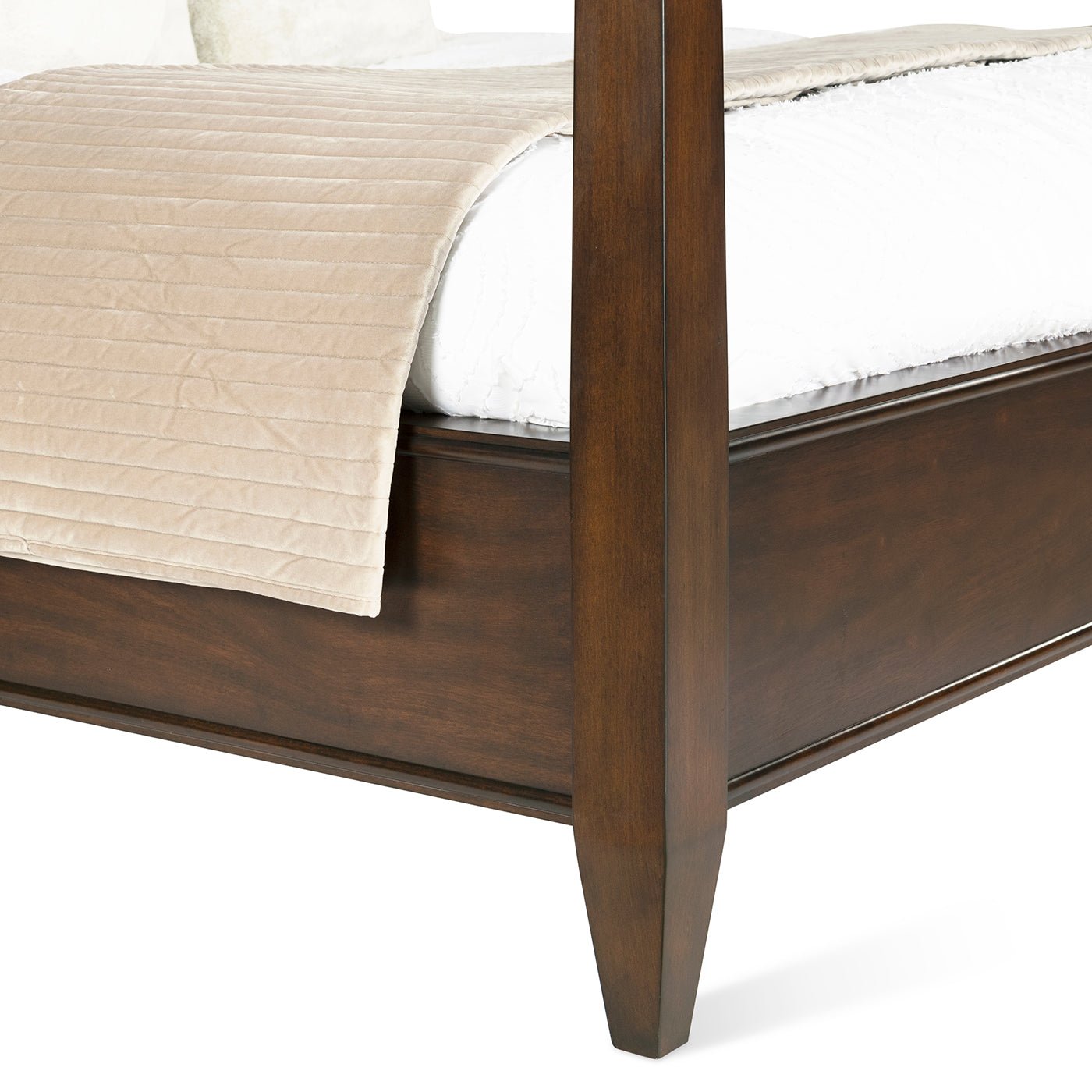 Close-up of frame and bedding on king poster bed.