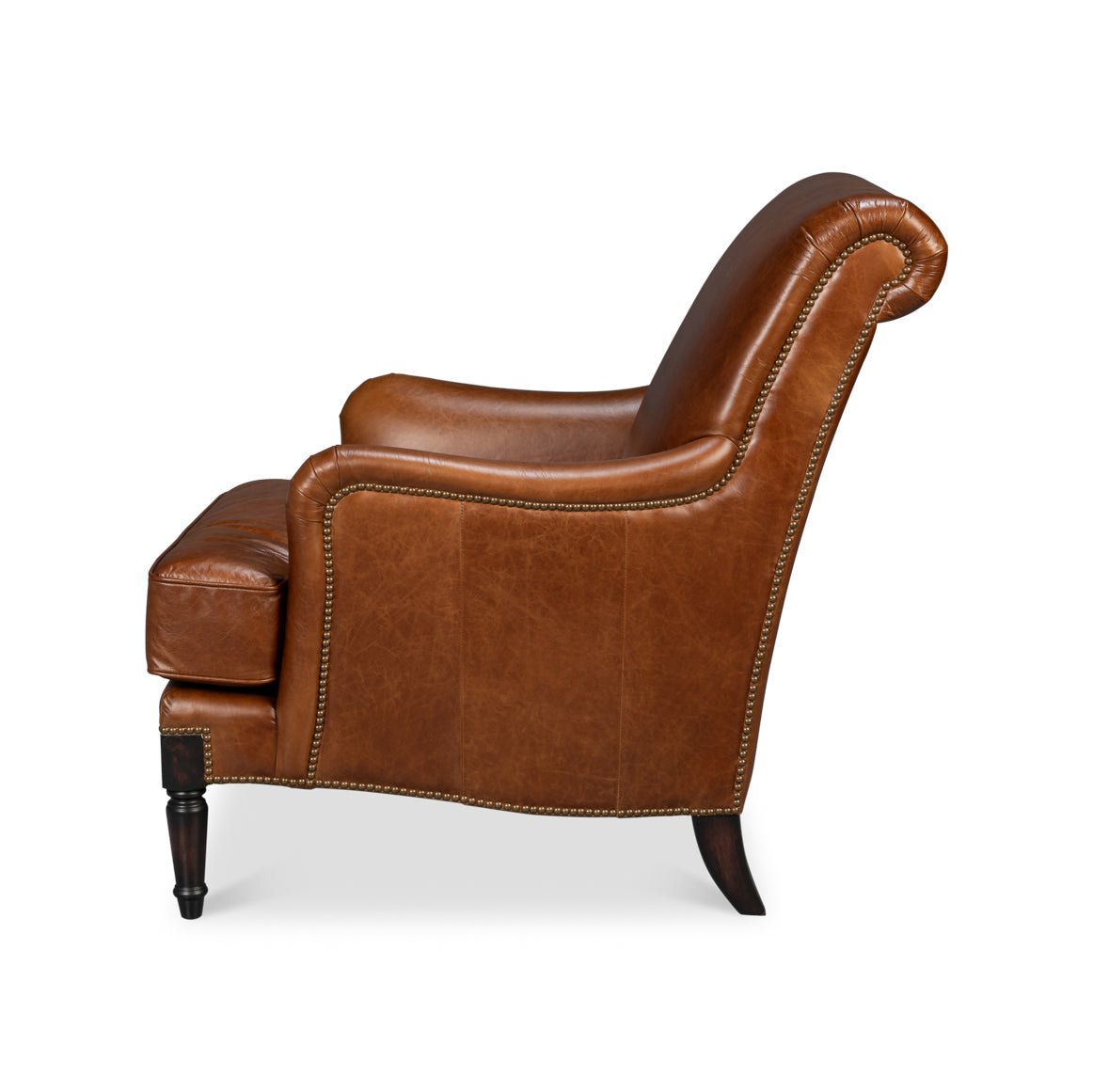 Side profile of brown leather club chair.