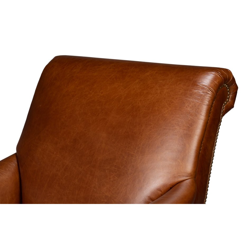 Upper back detail of leather club chair.
