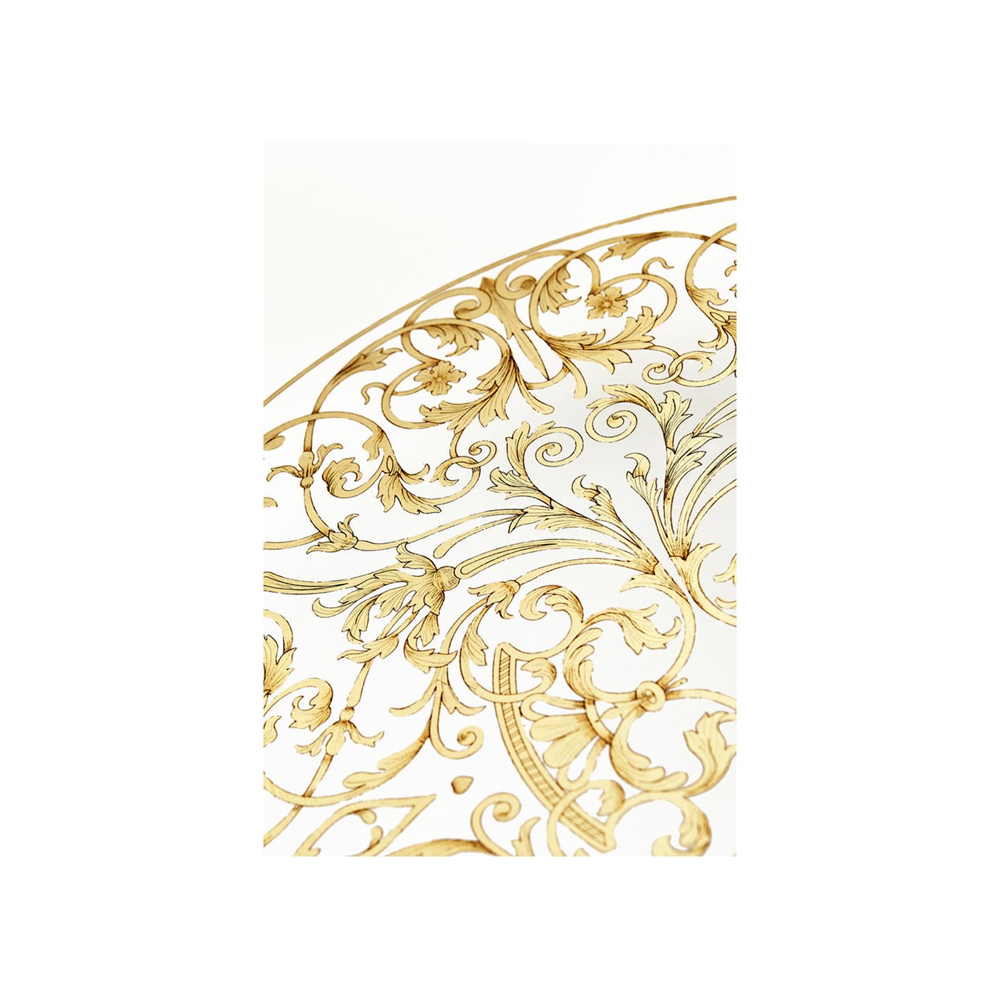 Close-up of ornate pattern on coffee table glass inset.