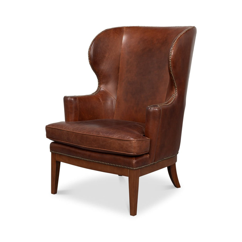 Brown leather wing chair front angle view.