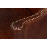 Close-up of chair arm nailhead trim detail.