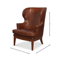 Brown leather wing chair with dimensions.
