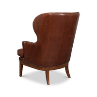Brown leather wing chair rear angle view.