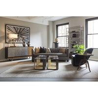 Living room with beige tufted sofa in stylish decor.