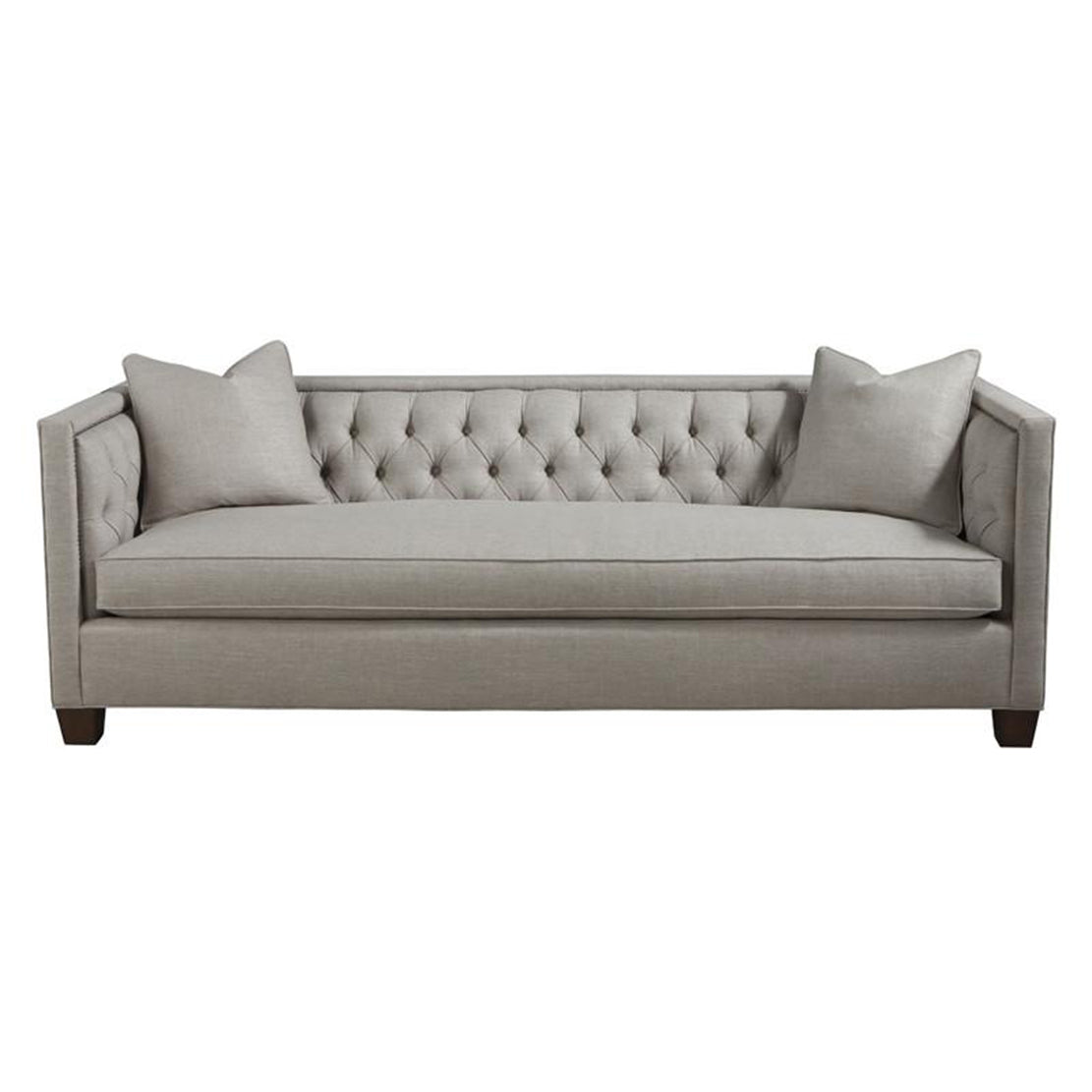Beige tufted sofa with pillows, front view.