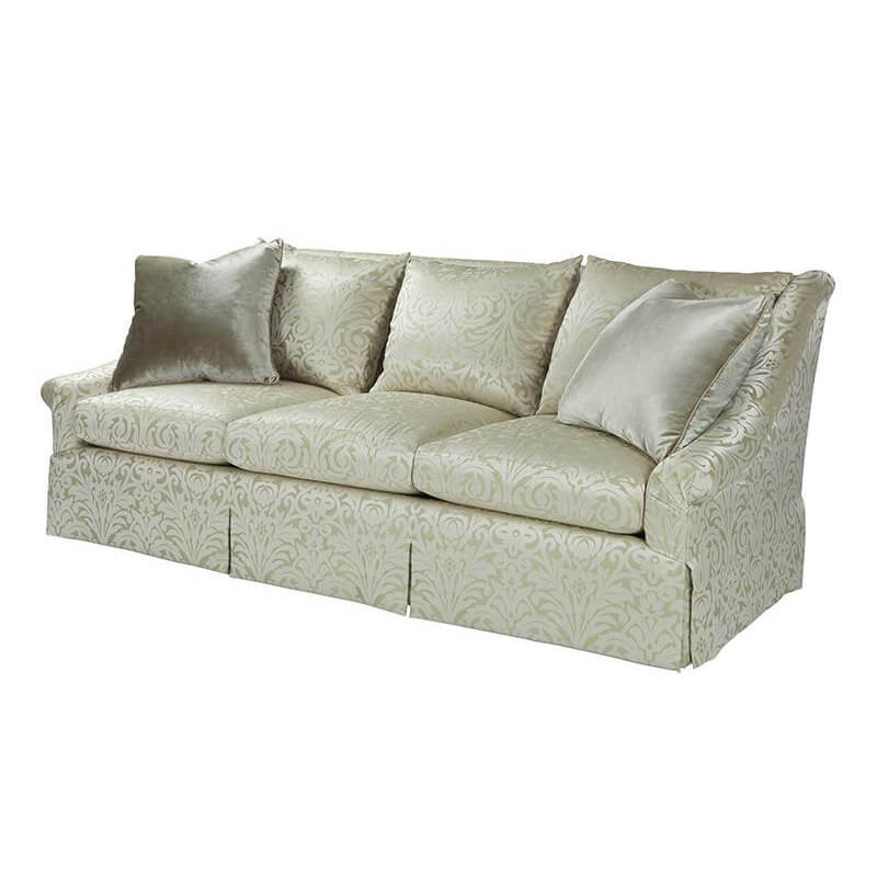 Angled view of transitional upholstered sofa with pillows.