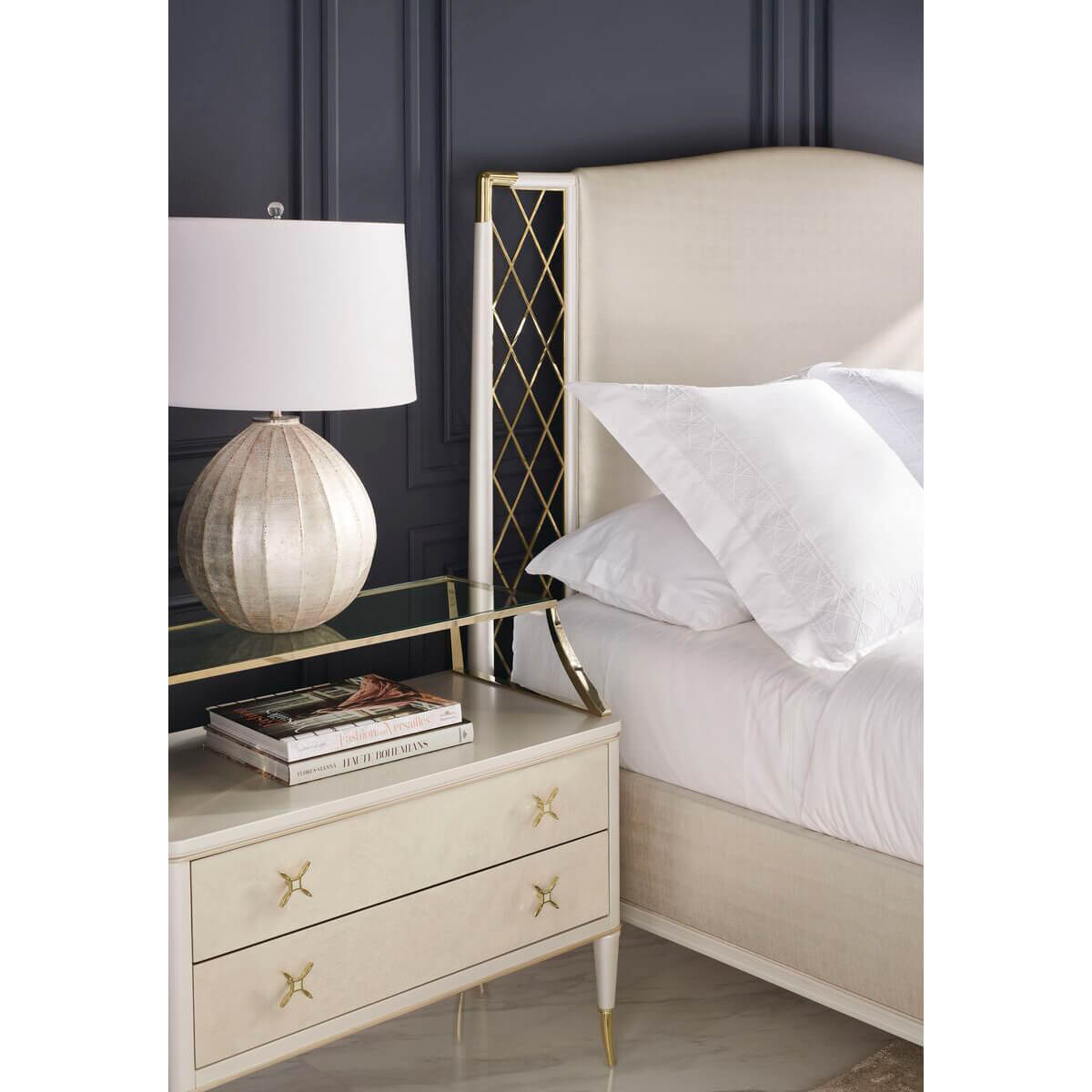 King bed detail with luxury nightstand and lamp.