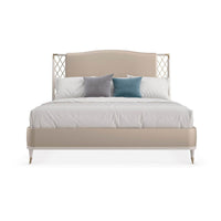 Front view of king bed with decorative pillows.