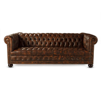 Full frontal Chesterfield sofa view with detailed leather texture.