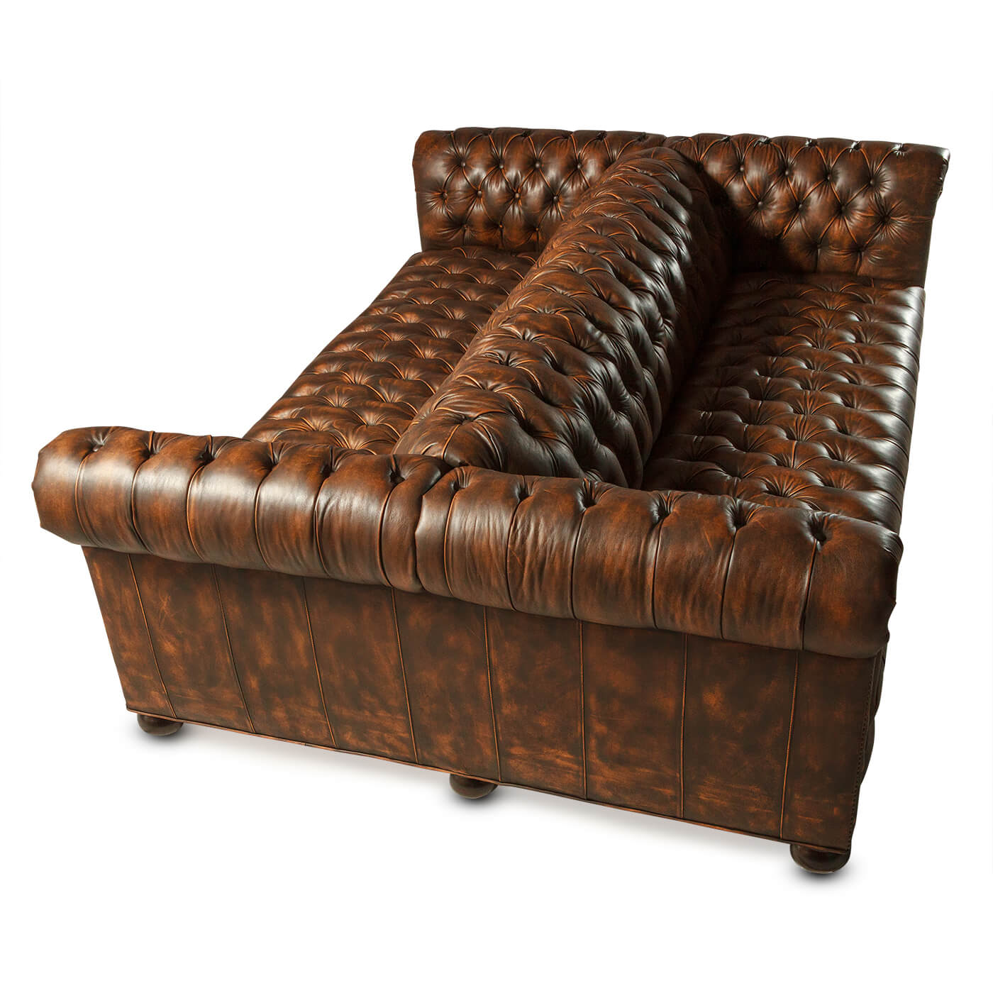 Double-sided tufted Chesterfield sofa, overhead view, rich leather.