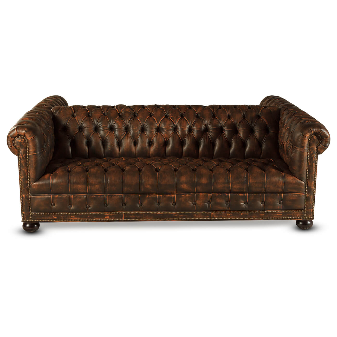 Front perspective of elegant tufted Chesterfield leather sofa.