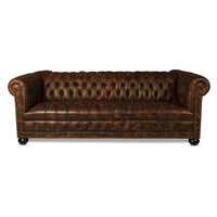 Frontal view of tufted leather Chesterfield sofa.
