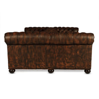 Back view of Chesterfield sofa with dark wooden legs.