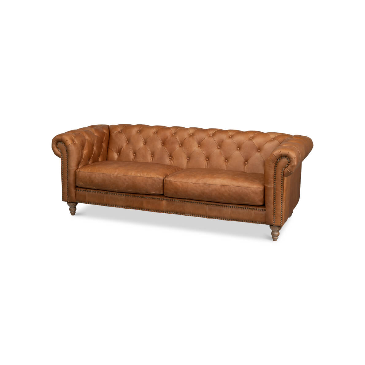 Tufted leather chesterfield sofa angled front view.