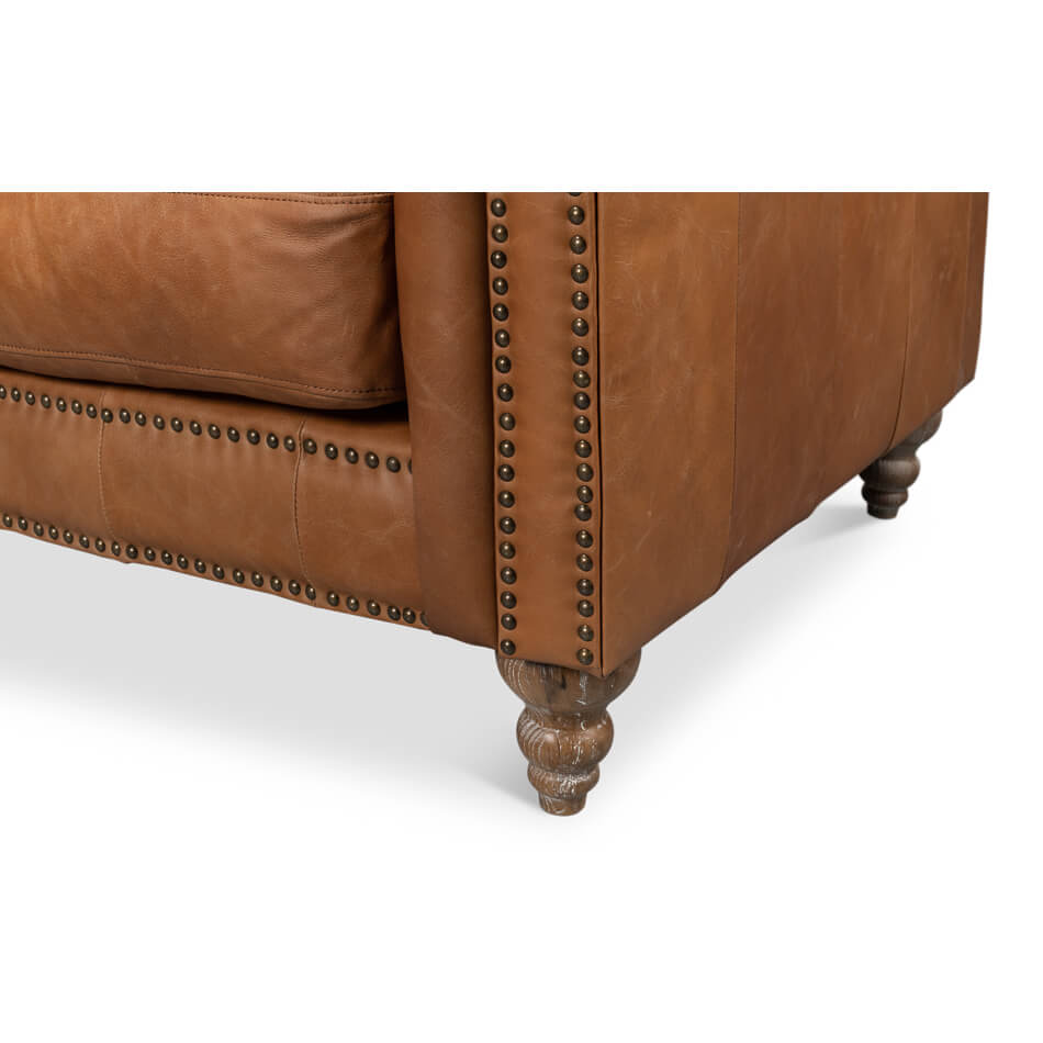 Leg and trim details chesterfield leather sofa.