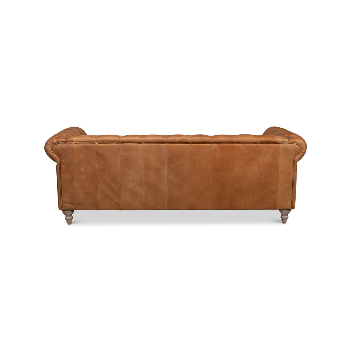 Back view of tufted leather chesterfield sofa.