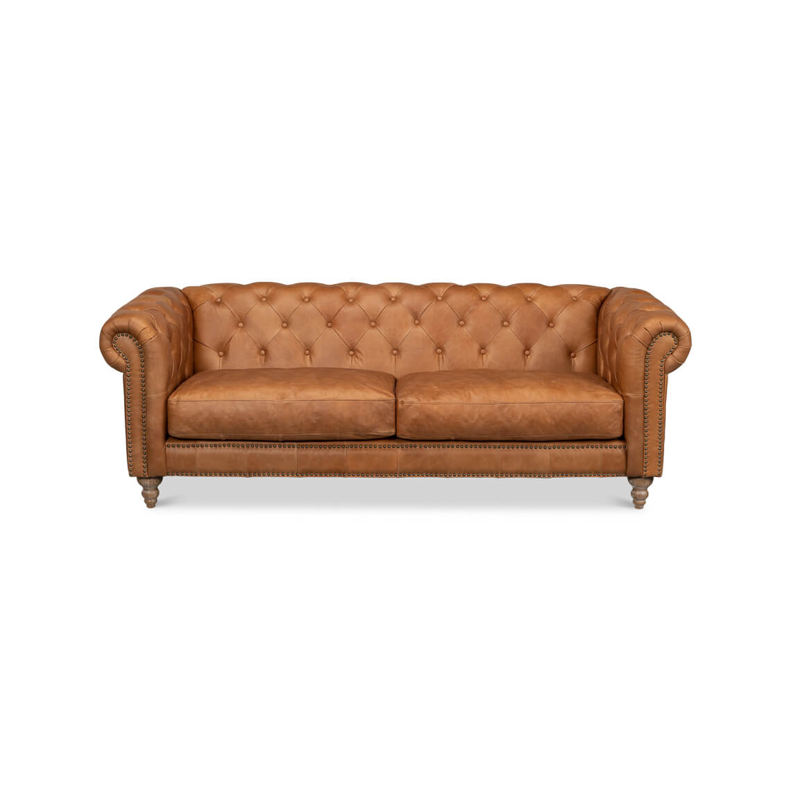Tufted leather chesterfield sofa front view.