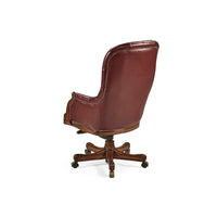 Tufted red leather swivel chair back view.