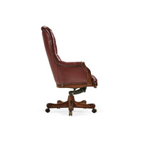 Tufted red leather swivel chair side profile view.