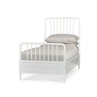 White spindle twin bed frame front view with bedding.