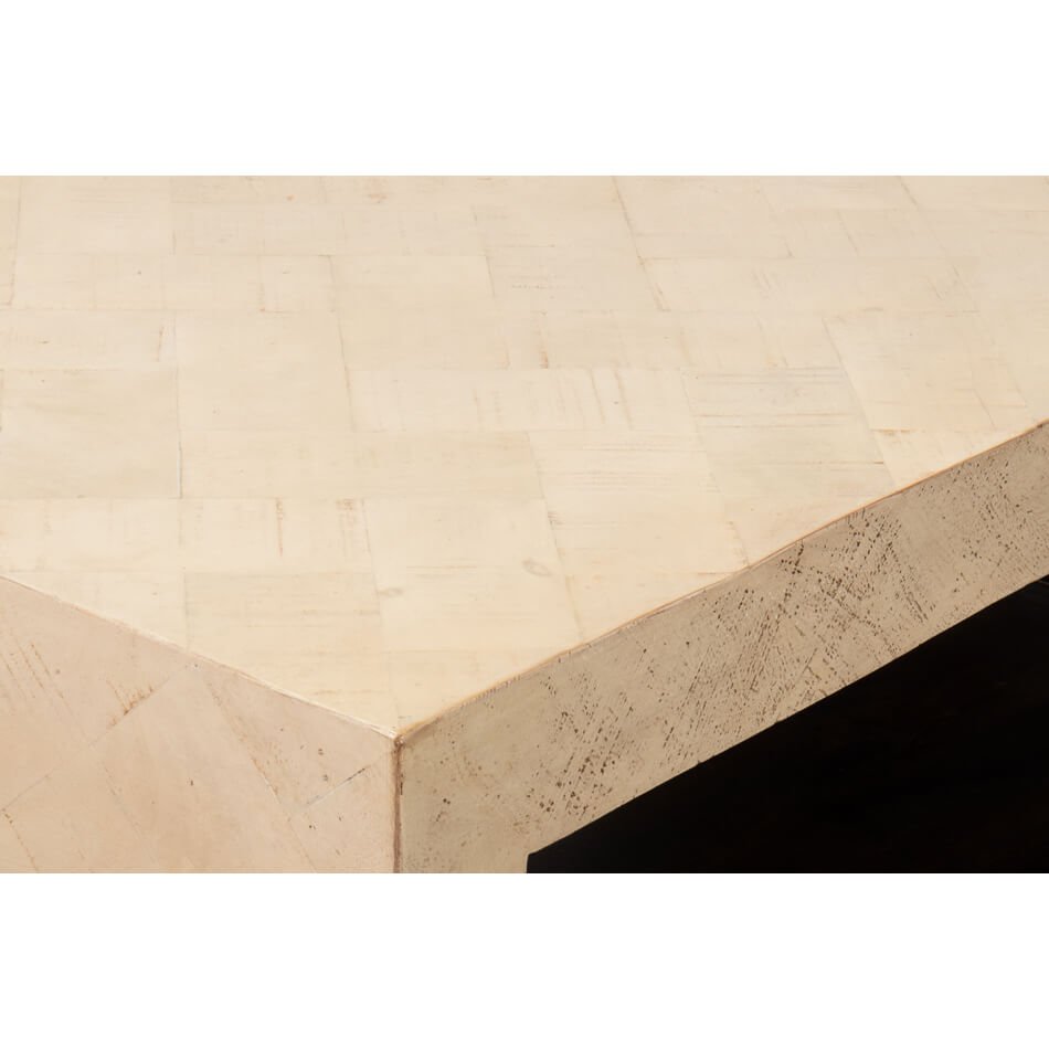 Close-up corner detail of geometric table finish.
