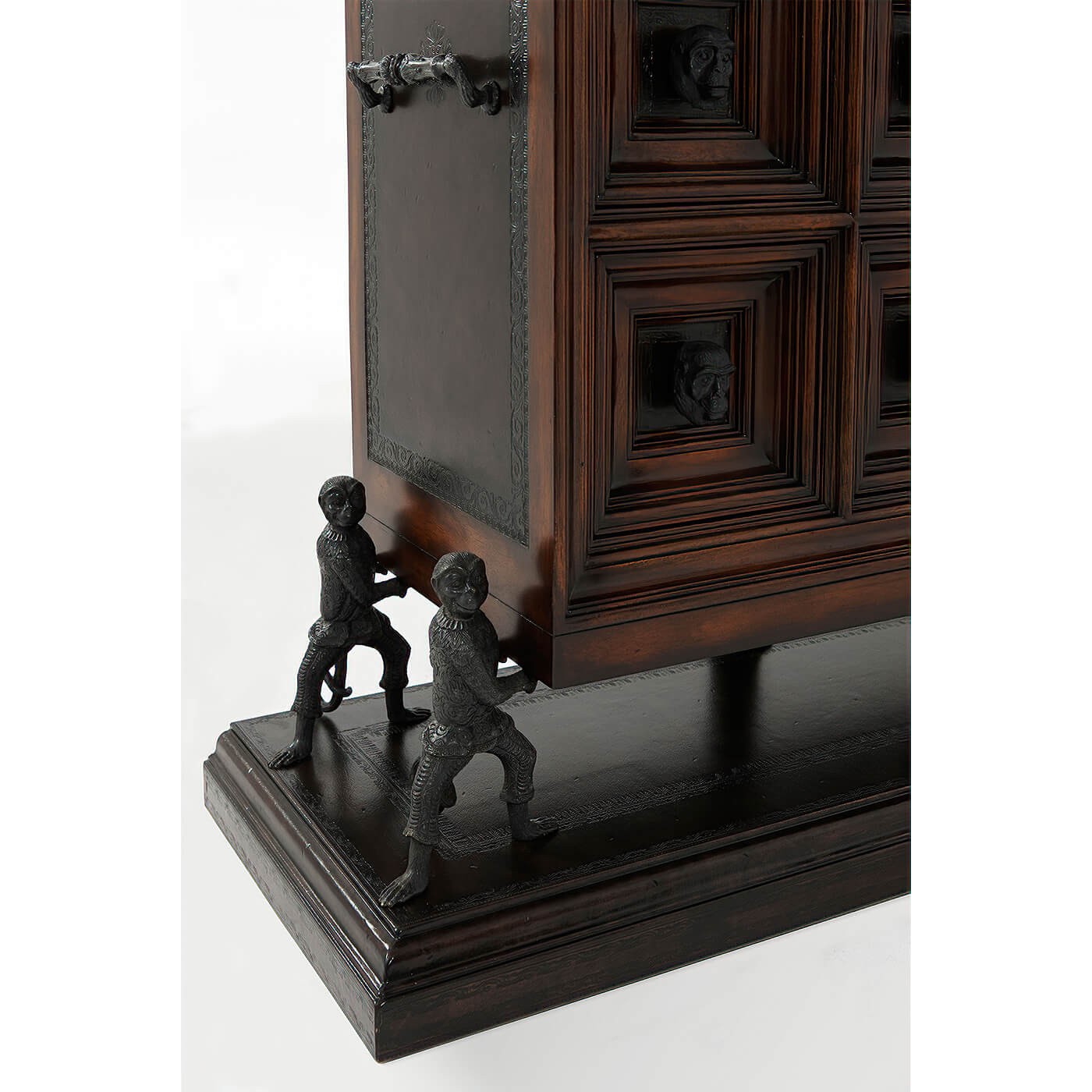 Base detail of Italian chest with sculptural figures.