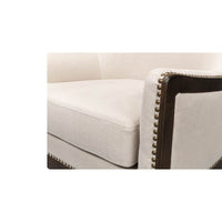 Armrest and cushion detailing on modern wingchair.