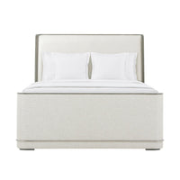 Front view of upholstered Art Deco bed with pillows.