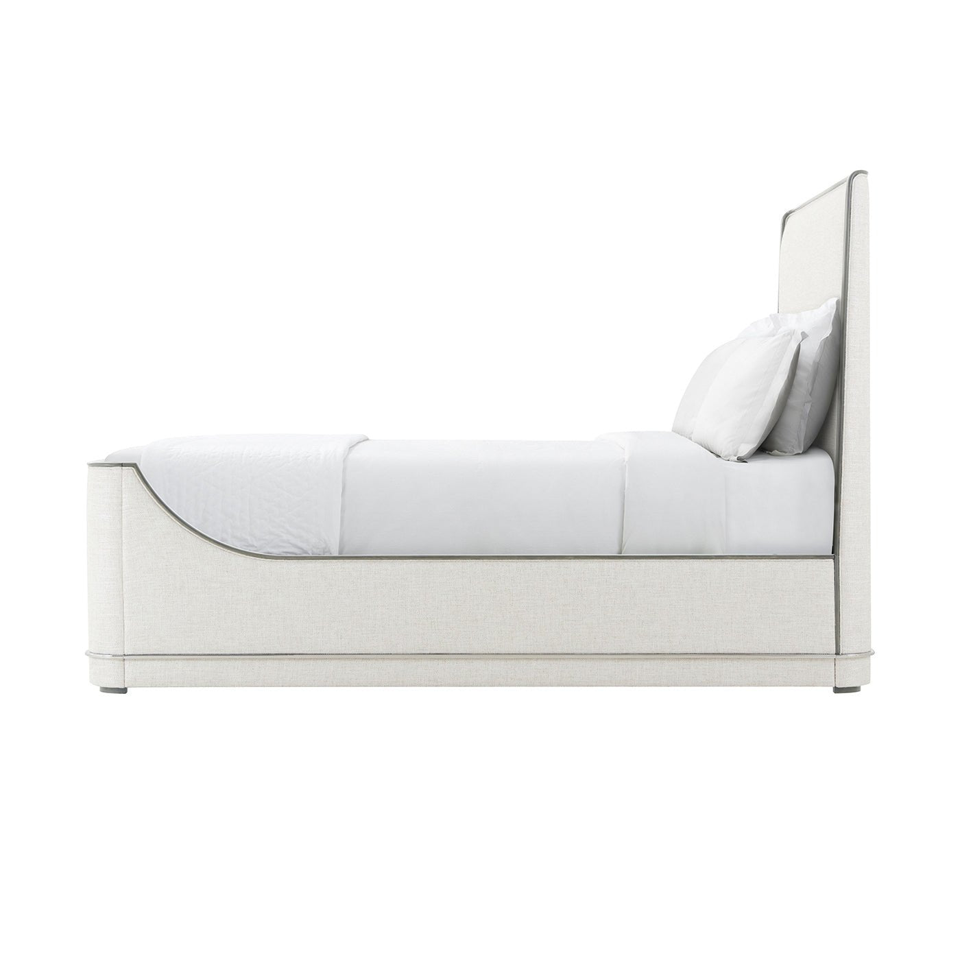 Side profile of upholstered Art Deco bed and pillows.