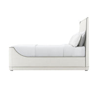 Side profile of upholstered Art Deco bed and pillows.