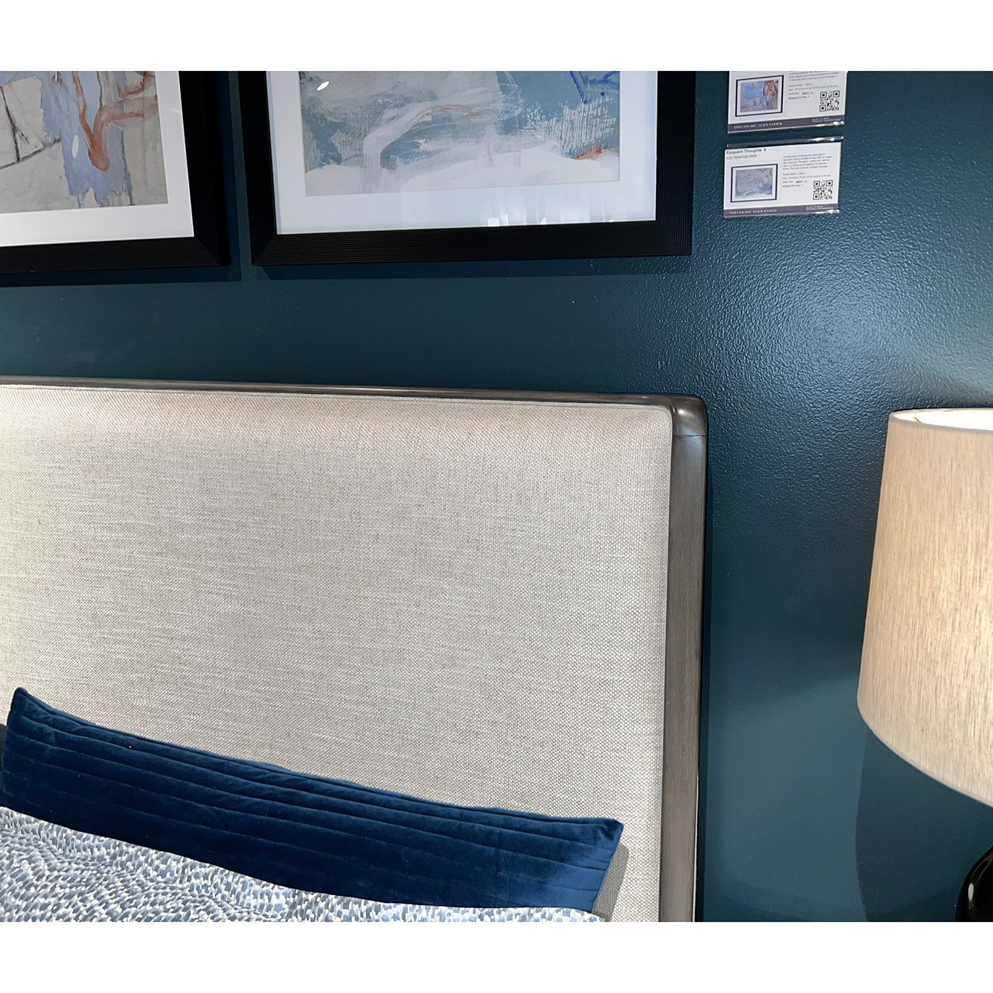 Headboard detail of upholstered Art Deco bed with decor.