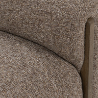 Close-up of the Bronzed Cocoa bench’s woven seat and rounded arm beside an exposed ash support