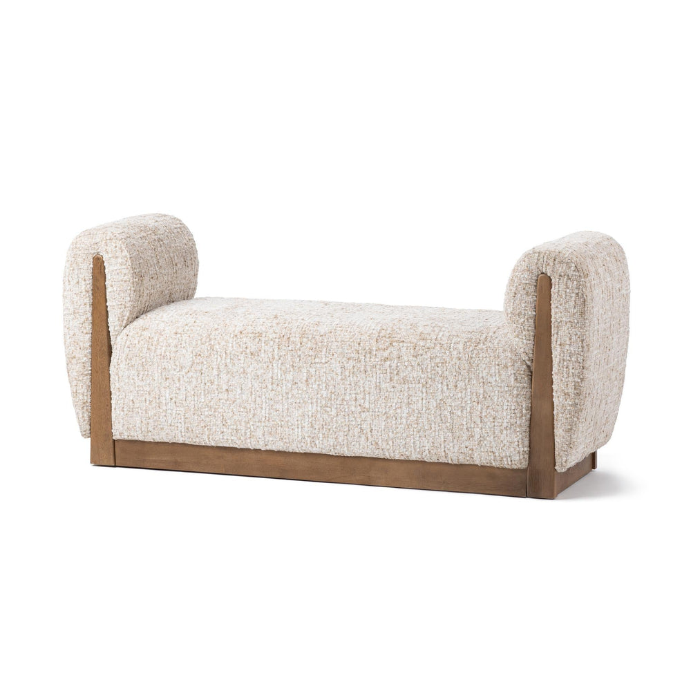Wheatfield upholstered bench at an angle, with curved padded arms and an exposed brown parawood frame