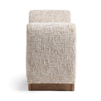 End view of the Wheatfield bench showing its rounded upholstered arm and brown wood base