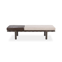 Front view of the two-tone fabric and leather bench with leather straps and cylindrical iron legs